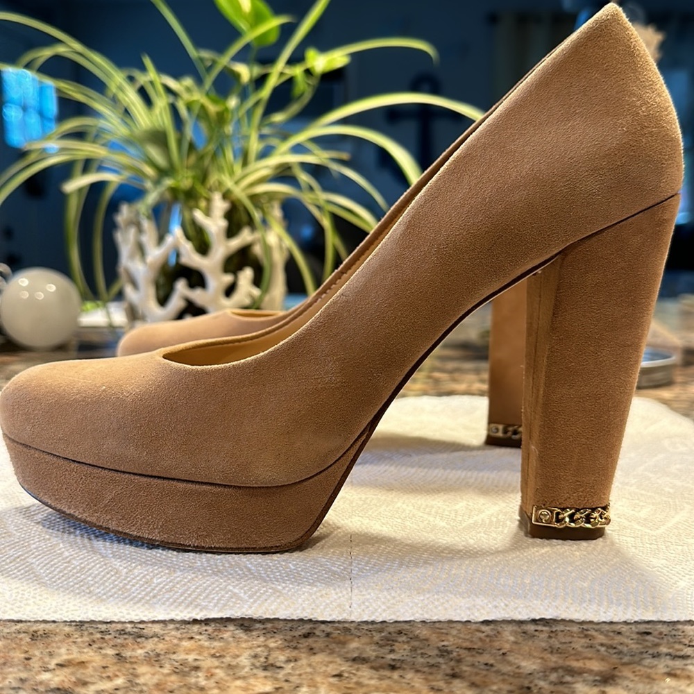 Sexy Michael Kors platform heels with elegant heel chain detail.